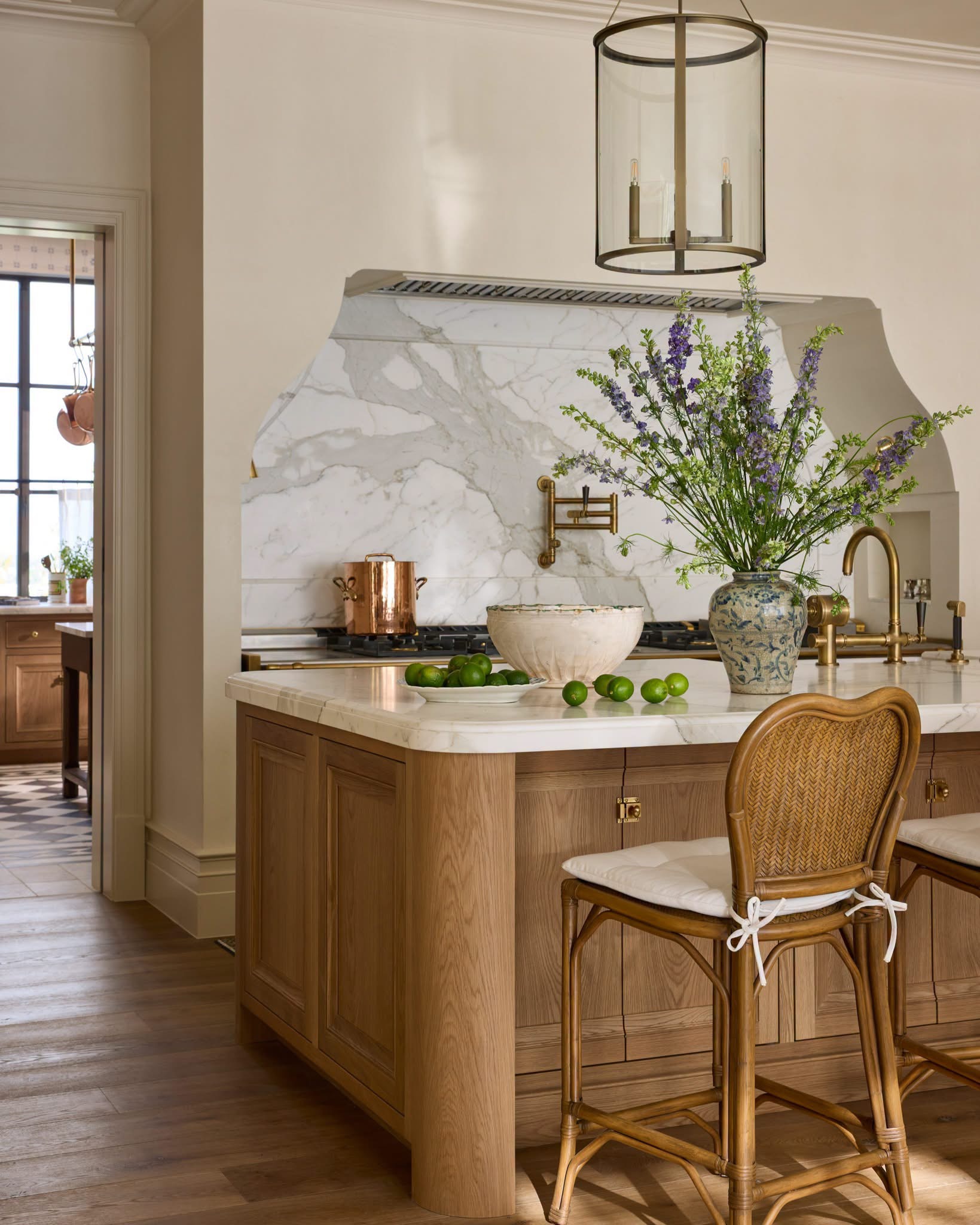 Marble kitchen island with fresh flowers and limes